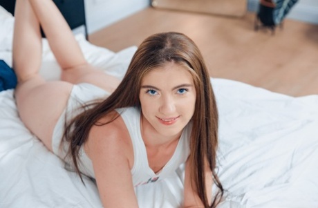 Nice teen Lana Lelani finger spreads her tight pussy on top of a bed 53386069